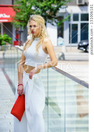 Woman wearing crop top and culottes Woman wearing crop top and culottes 131006181