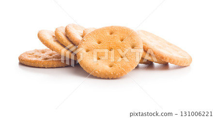 Crispy round salted crackers isolated on white background. Crispy round salted crackers isolated on white background. 131006221