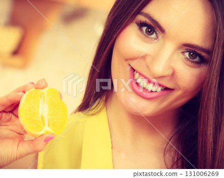 Female cook holding fruit. 131006269