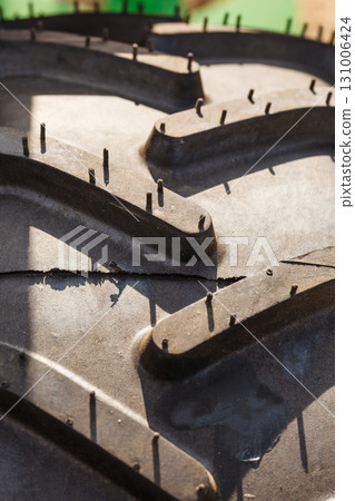 Detailed closeup of rubber tire surface 131006424