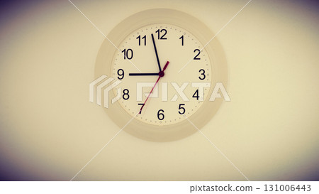 clock on wall showing nine hours 131006443