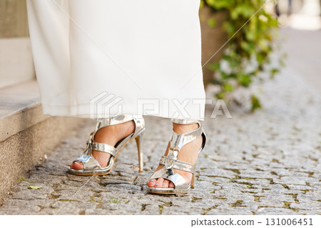 Woman wearing high heels and culottes 131006451