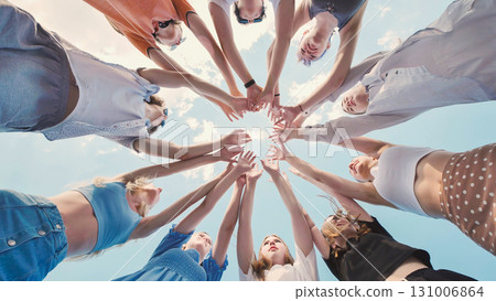 School friends coming together in a circle, representing their unity, teamwork, and strong bond School friends coming together in a circle, representing their unity, teamwork, and strong bond 131006864