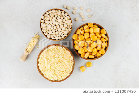 Gluten free lupine flour, dry lupine beans, protein rich snack of pickled lupine beans on gray background. Top view. 131007450