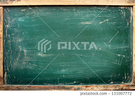 Rustic green chalkboard displays a textured surface, ideal for writing or drawing in classrooms, workshops, and creative spaces Rustic green chalkboard displays a textured surface, ideal for writing or drawing in classrooms, workshops, and creative spaces 131007772