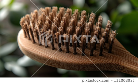 Natural bamboo brush with soft bristles for hair care in a serene setting 131008055