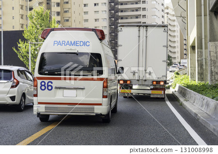 Ambulance driving image 131008998