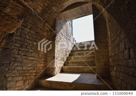 A corridor inside the Roman amphitheater in Nîmes, France (photographed on August 13, 2025) 131009049