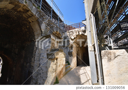 A corridor inside the Roman amphitheater in Nîmes, France (photographed on August 13, 2025) 131009056
