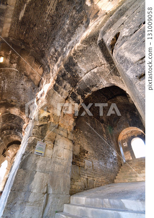 A corridor inside the Roman amphitheater in Nîmes, France (photographed on August 13, 2025) 131009058