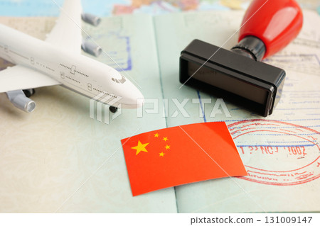 China passport with approved stamp on document for tourism to immigration at airport in country. China passport with approved stamp on document for tourism to immigration at airport in country. 131009147