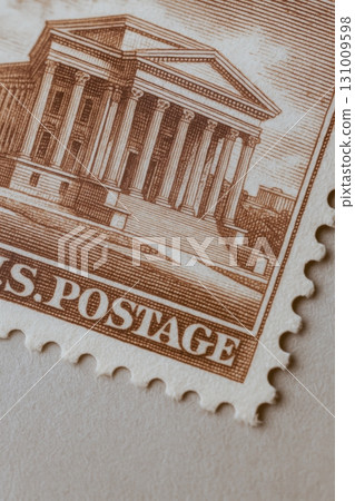 Close-up of vintage U.S. postage stamp featuring classical building design 131009598