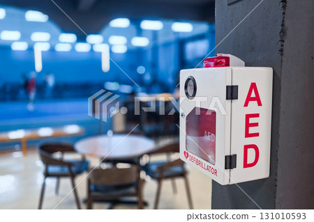 AED or Automated External Defibrillator installed on wall in Sports Gym as first aid in heart attack situation. 131010593