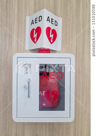 AED or Automated External Defibrillator installed on wall in public area as first aid in heart attack situation. 131010598