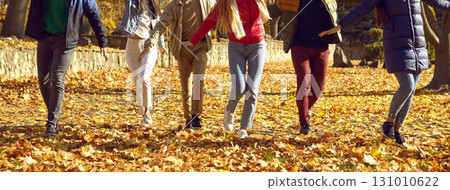 Legs and shoes of young people walking in park 131010622