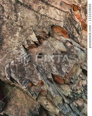 Rock formation showing layered sedimentary rock in pruhonice, czech republic Rock formation showing layered sedimentary rock in pruhonice, czech republic 131010688