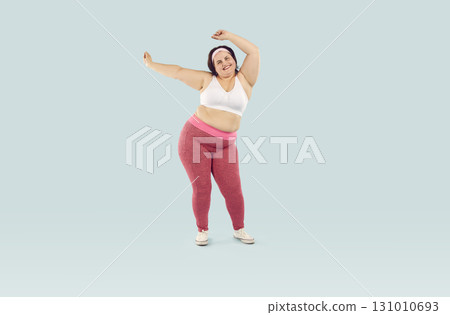 Full length shot of happy overweight, obese woman celebrating weightloss progress Full length shot of happy overweight, obese woman celebrating weightloss progress 131010693