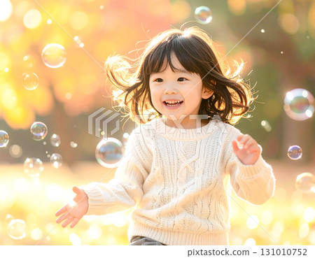 Soap bubbles and little girl 131010752