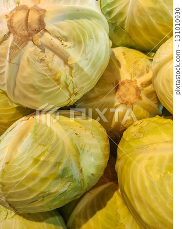 Fresh green cabbages forming a textured background at farmers market 131010930