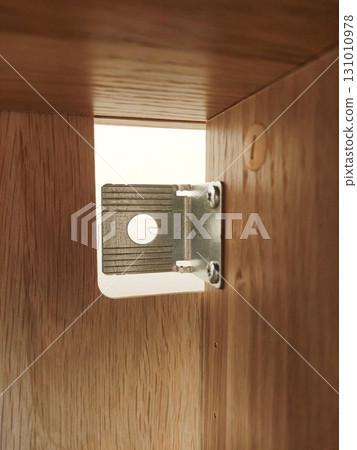 Metal furniture connector fastening wooden elements together Metal furniture connector fastening wooden elements together 131010978