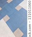 Geometric pattern of blue and white tiles creating visual interest on a floor 131011060