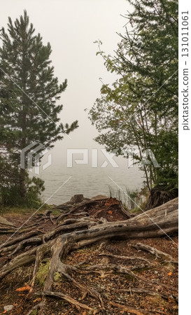 Fog rolling over strbske pleso lake in the high tatras mountains of slovakia 131011061