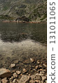 Rain falling on the transparent waters of strbske pleso in the high tatras mountains, slovakia 131011065