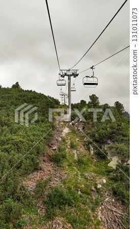 Chairlift ascending mountainside in high tatras, slovakia 131011073