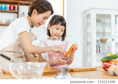 Elementary school girl helping with meals 131011489