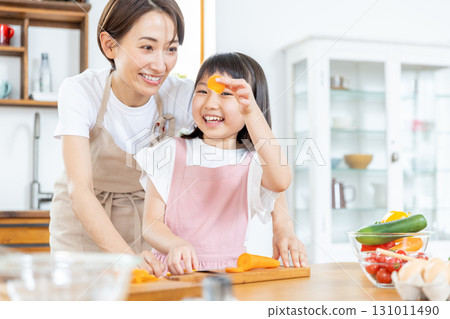 Elementary school girl helping with meals 131011490