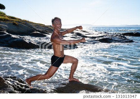 Portrait of a senior man with a well-trained body at the seaside Portrait of a senior man with a well-trained body at the seaside 131013347