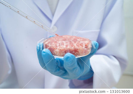 Scientist with cell culture in sample micro plate for research in science laboratory. Scientist with cell culture in sample micro plate for research in science laboratory. 131013600