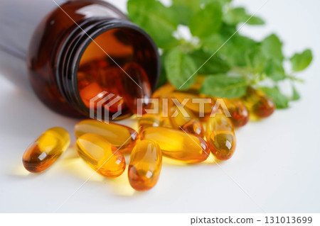 Alternative medicine herbal organic capsule with vitamin E omega 3 fish oil, mineral, drug with herbs leaf natural supplements for healthy good life. Alternative medicine herbal organic capsule with vitamin E omega 3 fish oil, mineral, drug with herbs leaf natural supplements for healthy good life. 131013699