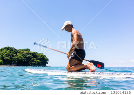 Senior man enjoying marine sports in the sea 131014126