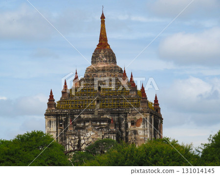 Thatbyinnyu Temple Rising from the Trees in Bagan, Myanmar Thatbyinnyu Temple Rising from the Trees in Bagan, Myanmar 131014145