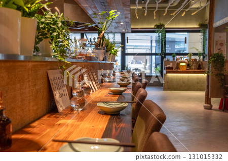 Warm and cozy dining space in log style 131015332