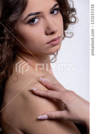 An Elegant and Striking Portrait Depicting a Beautiful Woman with a Soft and Gentle Expression An Elegant and Striking Portrait Depicting a Beautiful Woman with a Soft and Gentle Expression 131015338