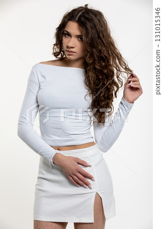 A Trendy Young Woman in a Chic and Stylish Outfit Posing Gracefully for a Photo Shoot 131015346