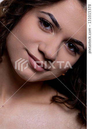 A Portrait of a Beautiful Smiling Woman with Radiant and Glittering Skin, Full of Life 131015378