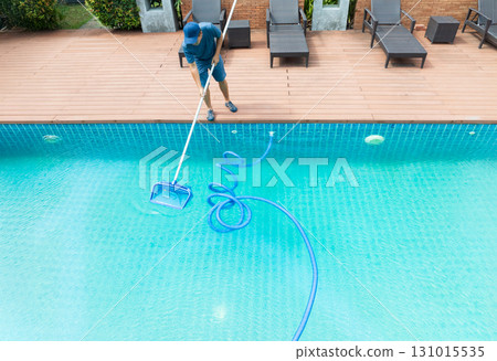 Pool maintenance with scoop net  and automatic robot cleaner. 131015535