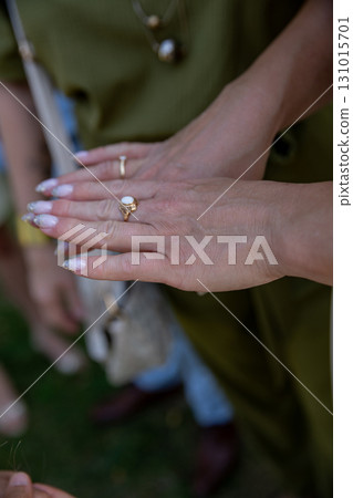 Elegant Hands Showcasing Jewelry Beautifully Set Against the Backdrop of Natures Splendor 131015701