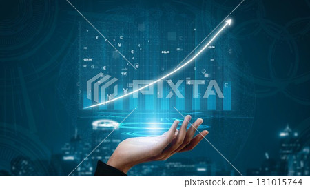 Business Growth Concept with Hand Holding Data Visualization and Financial Graphic Elements on Dark Blue Background for Financial Success Copula 131015744