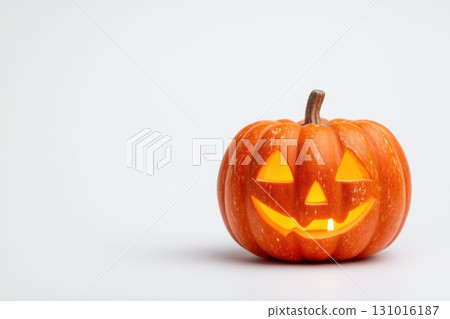 A cheerful Halloween Pumpkin featuring a glowing face that radiates festive joy and spirit 131016187