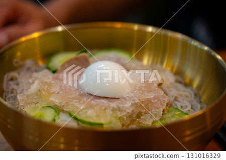Refreshing Korean Cold Noodles Naengmyeon with Beef Cucumber and Boiled Egg  131016329