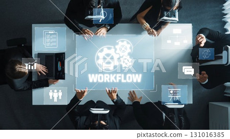Professionals Collaborating on Workflow Solutions with Technology and Innovative Tools in a Contemporary Office Setting. Raster Professionals Collaborating on Workflow Solutions with Technology and Innovative Tools in a Contemporary Office Setting. Raster 131016385