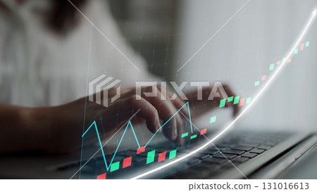 Hands Typing on Laptop with Digital Graph Overlay Illustrating Financial Growth and Market Trends in Modern Workspace Setup Copula 131016613
