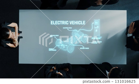 Innovative Electric Vehicle Presentation with Focus on Technology, Components, and Charging Stations Around Table in Modern Office Environment. Raster Innovative Electric Vehicle Presentation with Focus on Technology, Components, and Charging Stations Around Table in Modern Office Environment. Raster 131016625