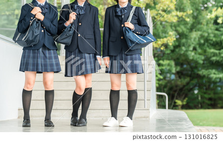 Smiling female high school students walking through the school building (going to school, going home, commuting to school) Smiling female high school students walking through the school building (going to school, going home, commuting to school) 131016825