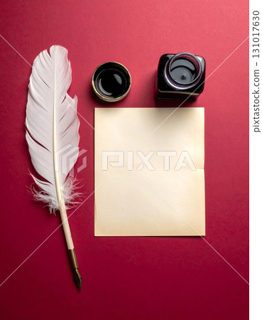 An antique quill pen with a black inkwell resting on vintage parchment paper An antique quill pen with a black inkwell resting on vintage parchment paper 131017630