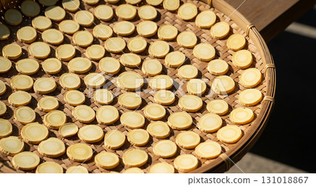 Sun-Dried Ginseng Slices on Bamboo Tray Sun-Dried Ginseng Slices on Bamboo Tray 131018867